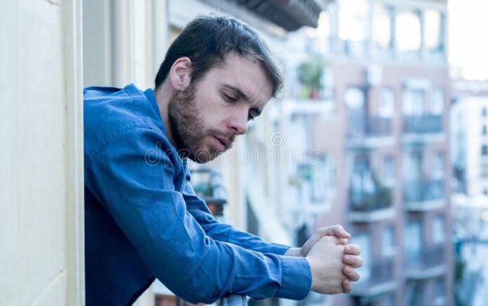 depressed-man-looking-out-home-balcony-mental-health-concept-lonely-sad-staring-outside-house-feeling-distress-miserable-154439355