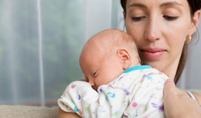 2_Pretty-woman-holding-a-newborn-baby-in-her-arms
