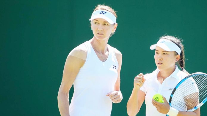 Makoto Ninomiya of Japan and Renata Voracova of the Czech Republic during the women s doubles first