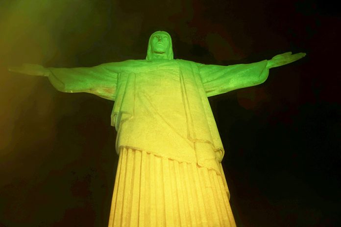 Christ the Redeemer statue is lit up in Brazilian colours as a tribute to late Pele in Rio De Janeiro