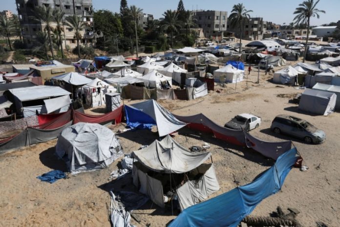 Palestinians shelter in a tent camp which was recently attacked in Israeli strikes, amid the Israel-Hamas conflict, in Khan Younis in the southern Gaza Strip