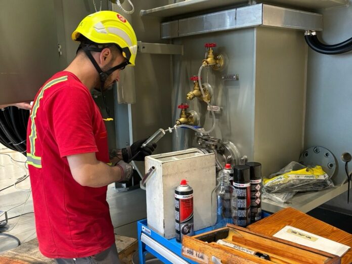 Photo of worker during testing of the equipment