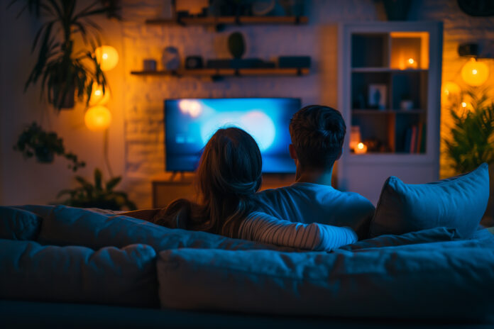 couple-watching-tv-relaxing-night-sofa