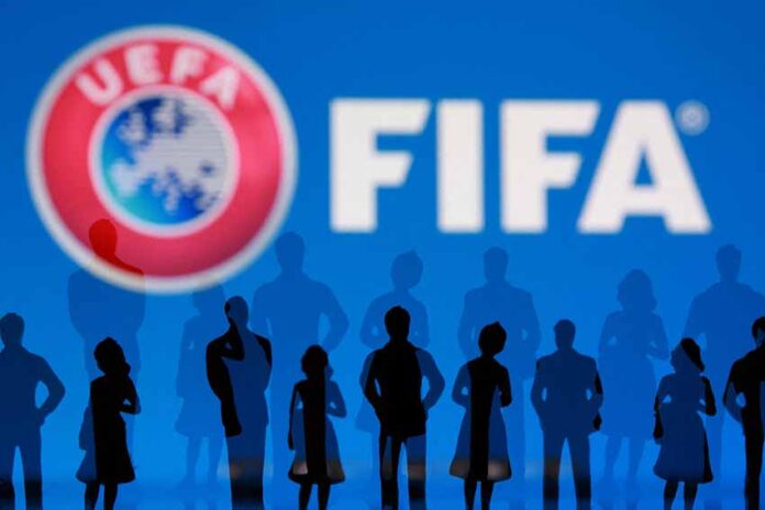 Illustration shows UEFA, FIFA logos and silhouettes