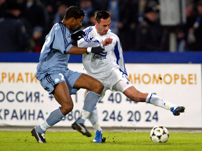 FILE PHOTO: DNIPRO DNIPROPETROVSK'S MAKSYMYUK CHALLENGES OLYMPIQUE MARSEILLE'S BEYE DURING THEIR UEFA CUP MATCH ...
